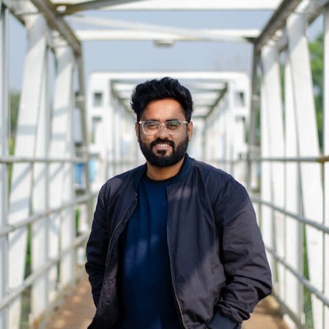 Asif Ahmed smiling outdoors